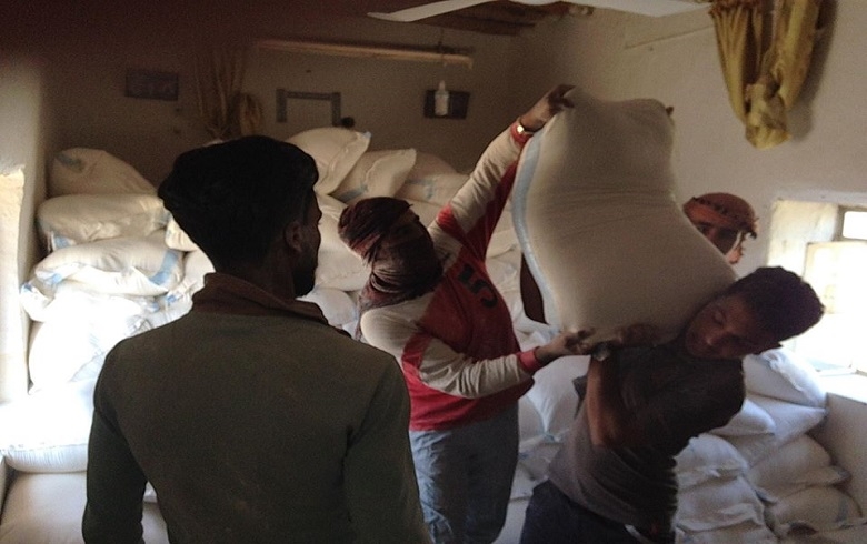 Distributing Flour to Widowed and Displaced Families 